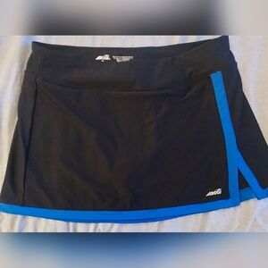 Avia tennis / golf active skort. Size large. Black with blue trim.